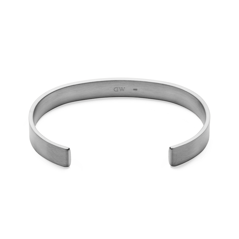 Line Cuff Brushed Silver featuring a slim open cuff shape, brushed stainless steel finish, and discreet inner logo, designed for a comfortable and minimalist look.