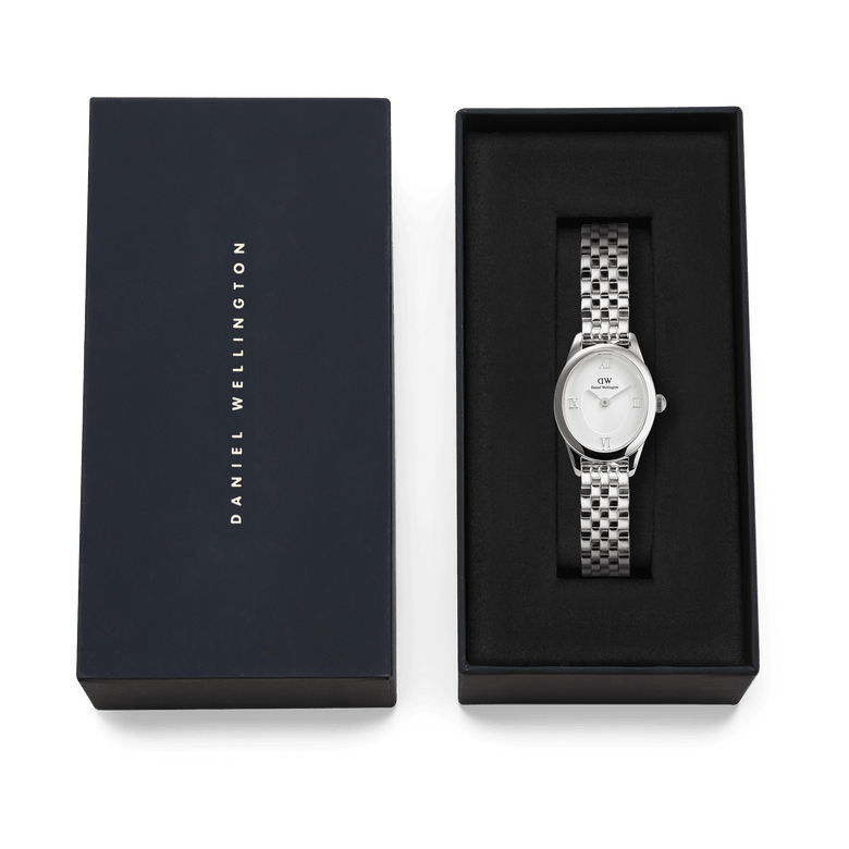 Ophelia Mini Silver watch with a polished oval case and 5-link bracelet, presented in a black Daniel Wellington gift box, ideal for gifting or adding to your collection.