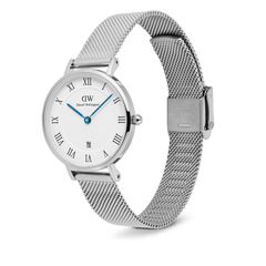 Petite Roman Numerals Date Silver watch with a polished stainless steel case, guilloché dial, blue hands, Roman numerals, date window at 6 o’clock, and an adjustable silver mesh strap.