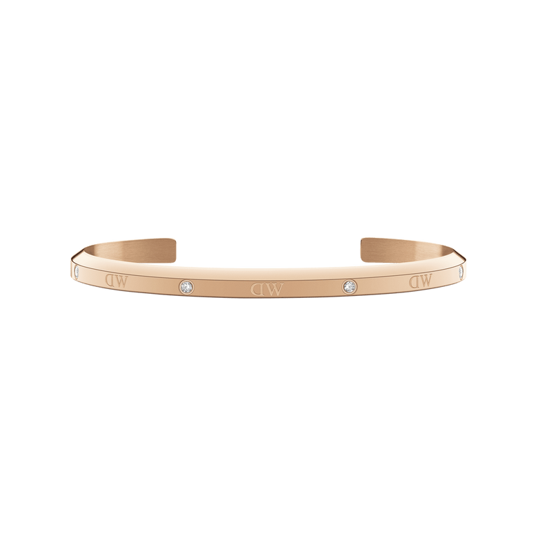 Slim rose gold cuff bracelet featuring six sparkling crystals and a minimalist design, crafted for women and suitable for stacking or pairing with other jewellery.