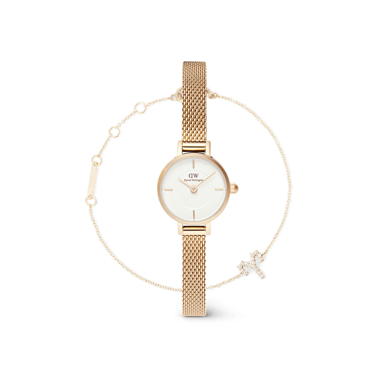Petite Mini & Zodiac Bracelet Gold Set featuring a petite gold mesh strap watch with a white dial and a delicate gold chain bracelet adorned with a crystal zodiac charm, styled for elegant everyday wear.