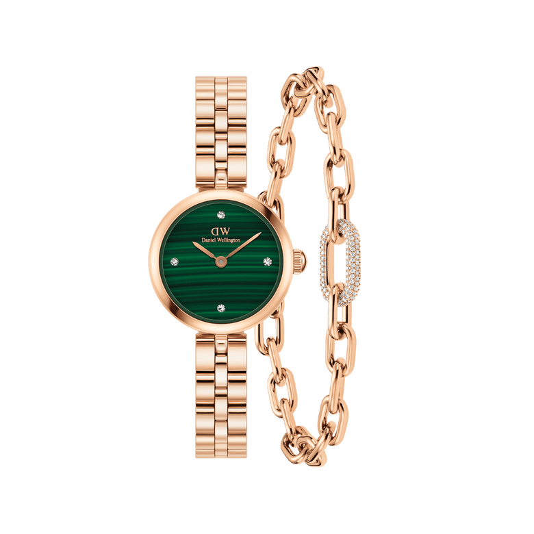 Rose gold Daniel Wellington watch with a malachite green dial and crystal hour markers, paired with a matching rose gold link bracelet featuring a pavé crystal accent and modern chain design.