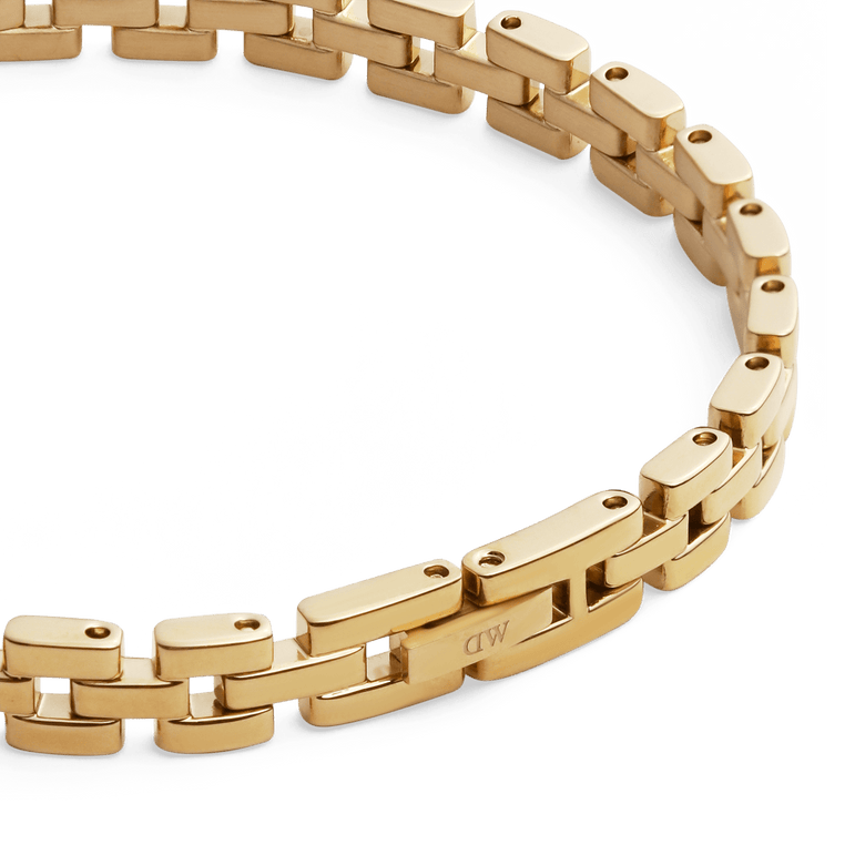 Detailed view of the 3-Link Bracelet Gold, showing the interlocking rectangular gold-plated links and the secure fold-over clasp with a smooth, polished finish.