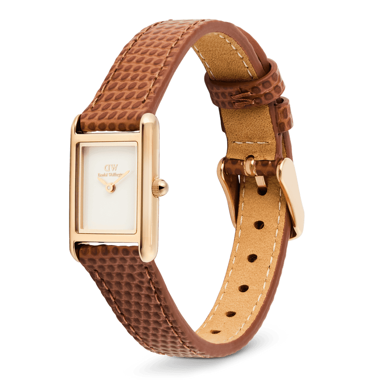 Daniel Wellington Bound Mini Light Brown Lizard Rose Gold watch with a slim rectangular rose gold case, minimalist white dial, and adjustable light brown lizard-textured leather strap, shown at an angle highlighting the pin buckle and fine stitching.