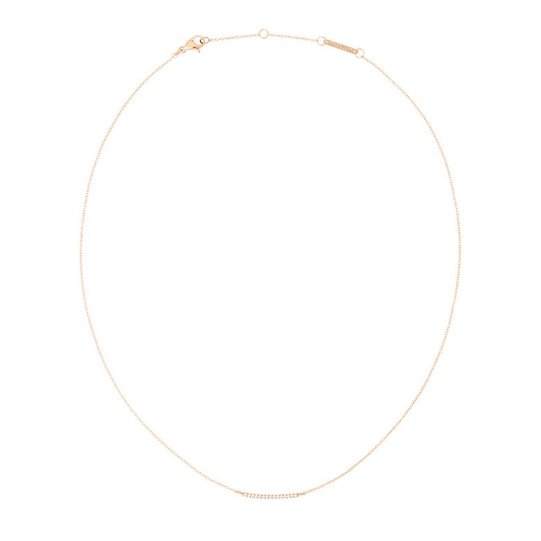 Delicate rose gold necklace featuring a slender bar pendant set with sparkling white cubic zirconia crystals, displayed on a fine adjustable chain.