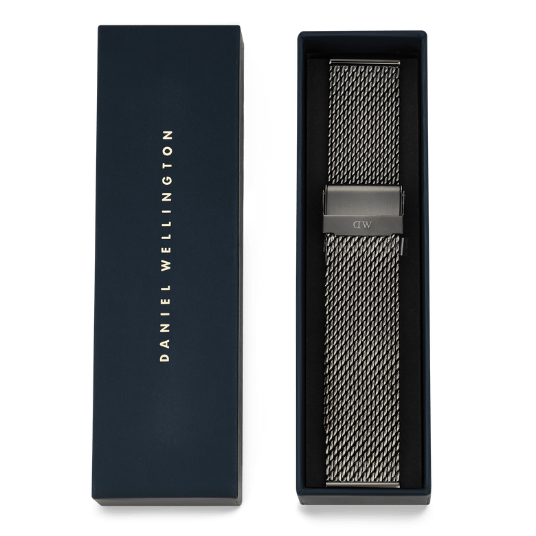 Graphite Mesh Strap presented in a Daniel Wellington box, featuring a 21mm stainless steel mesh design with a folded clasp and a contemporary graphite finish, ready as a stylish gift or watch upgrade.