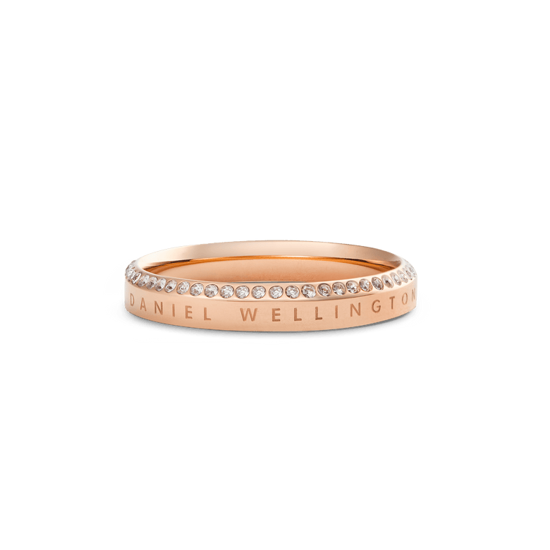 Classic Aura Ring Rose Gold featuring a slim rose gold band with a row of white crystals set along the chamfered edge and subtle engraved branding for a refined, elegant finish.