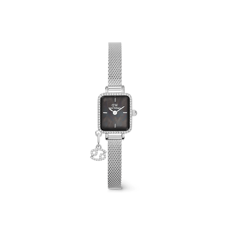 Silver ladies watch with a rectangular crystal-framed case, black mother of pearl dial, and an adjustable mesh strap, featuring a detachable zodiac charm with crystal accents.