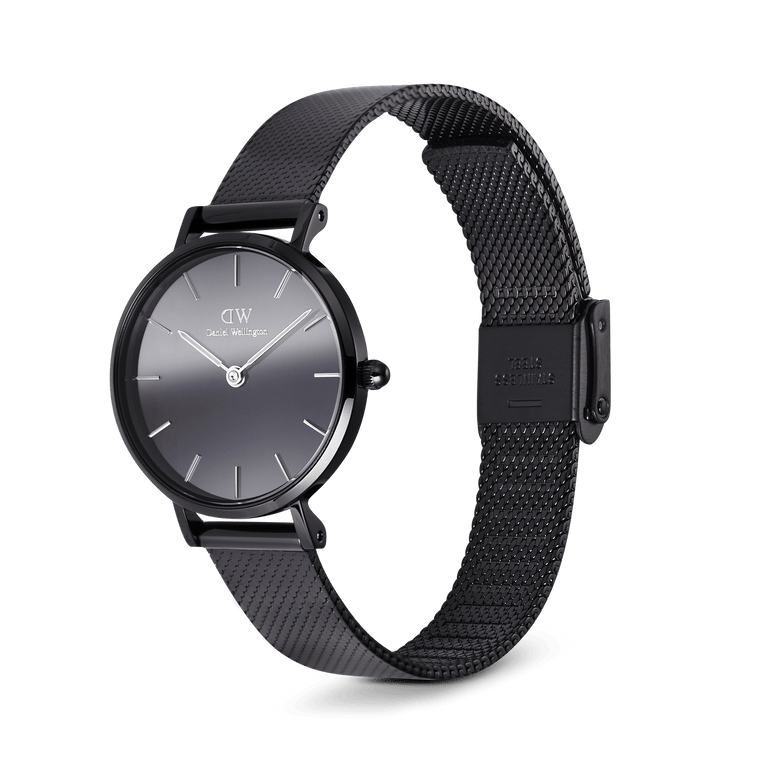 Daniel Wellington Petite Reflection Black watch featuring a 28mm black mirror glass dial, minimalist markers, and a polished black mesh stainless steel strap with an adjustable clasp.