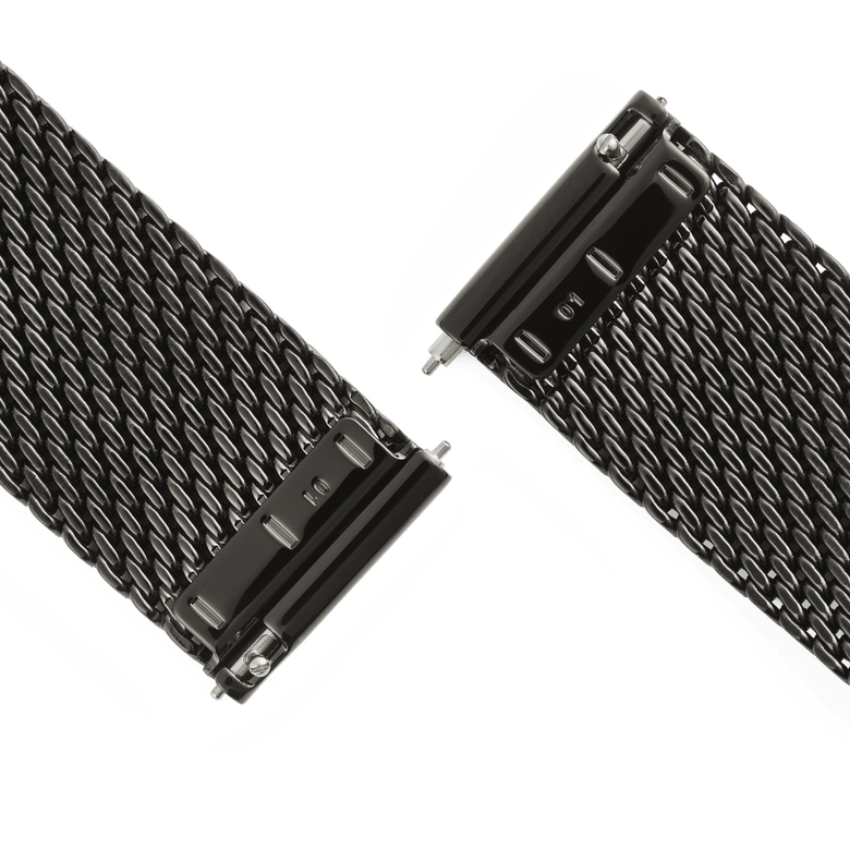 Close-up of the Graphite Mesh Strap showing the quick-release spring bars and fine woven stainless steel mesh in a deep graphite finish, designed for easy adjustment and a secure fit.
