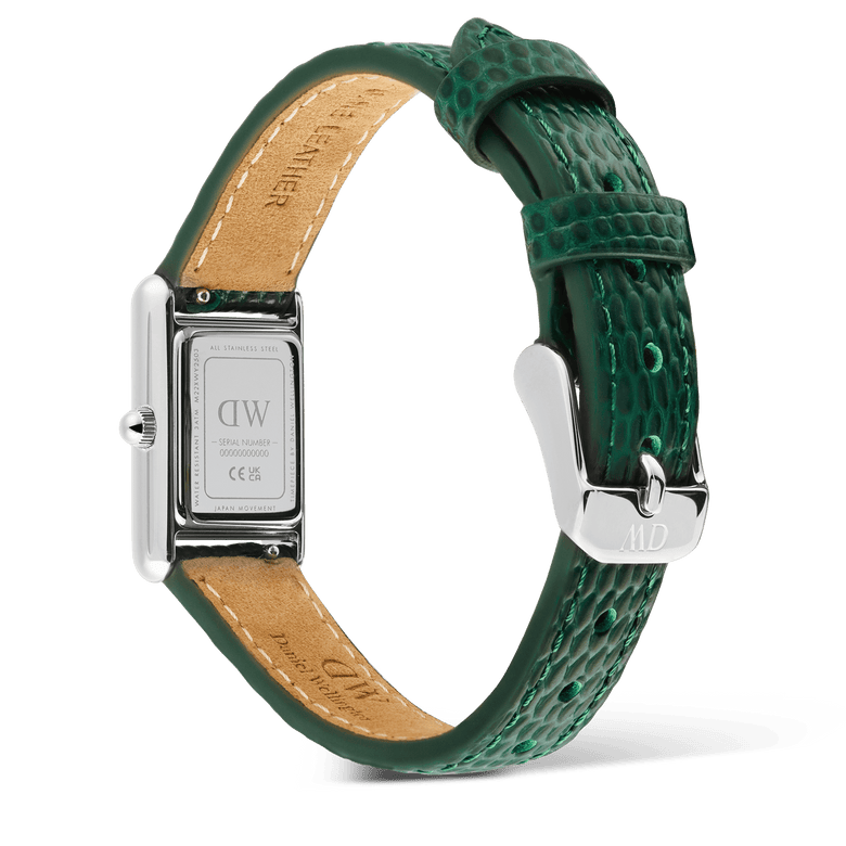 Rear view of the Bound Mini Green Lizard Silver watch showing the engraved stainless steel case back, textured green leather strap, and polished silver pin buckle with tan leather lining.