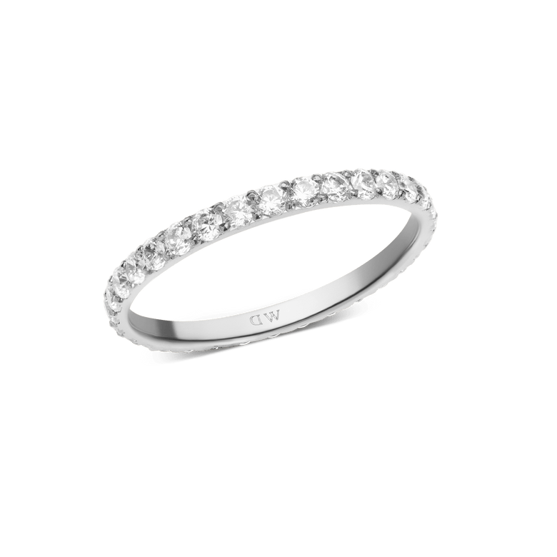 Slim silver eternity ring featuring a row of white cubic zirconia crystals, designed with a minimalist band for a refined and modern look.
