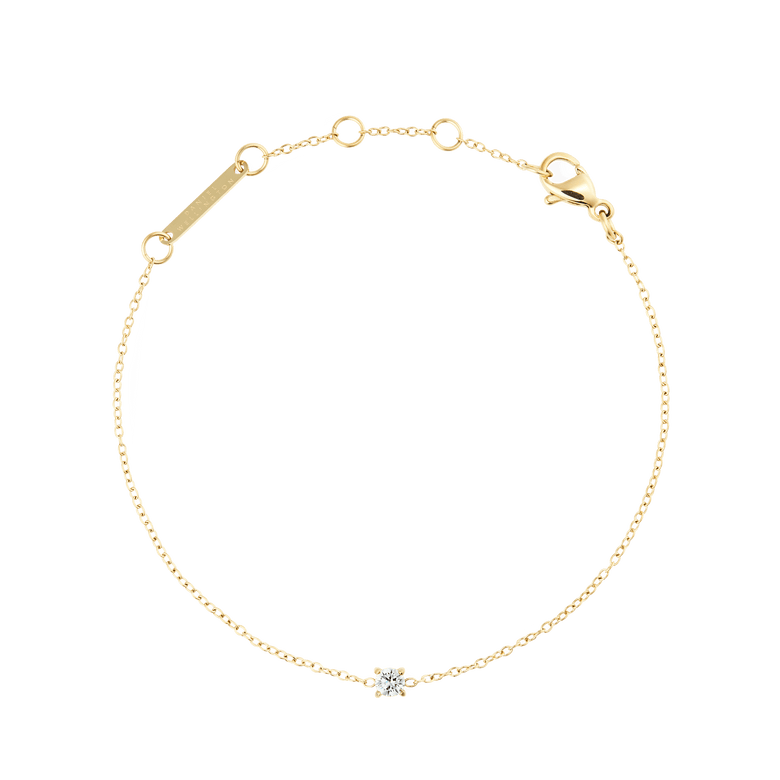 Delicate gold bracelet featuring a slim adjustable chain with a single white cubic zirconia stone set at the centre, designed for a refined and minimalist look.