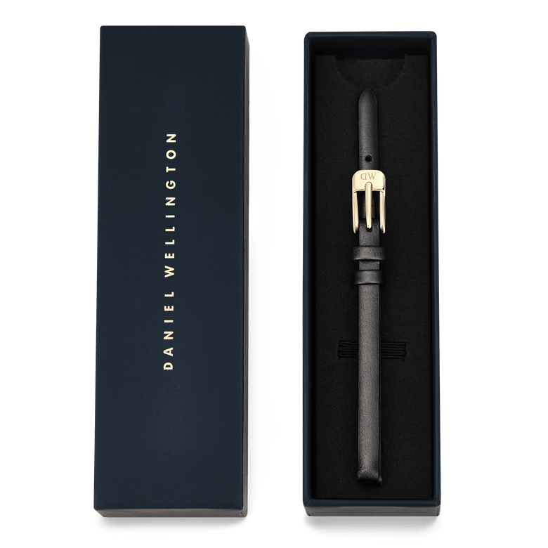 Pressed Sheffield Strap Gold presented in a navy Daniel Wellington gift box, featuring a slim black leather strap with a gold buckle, ideal for smaller watch faces and an elegant, minimalist upgrade.