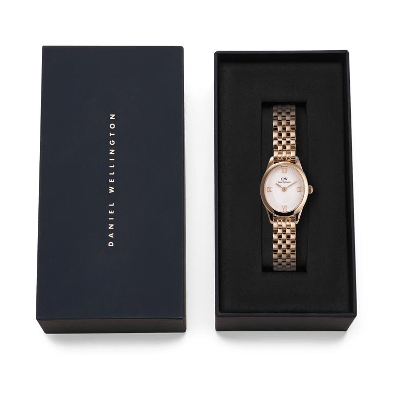 Ophelia Mini Rose Gold ladies watch with a polished rose gold bracelet and white sunray dial, elegantly presented in a black Daniel Wellington gift box.