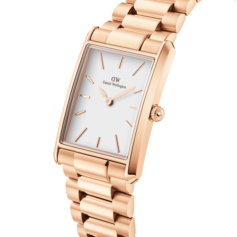 Bound 3-Link Rose Gold watch with a rectangular rose gold case, minimalist white dial, and polished 3-link bracelet, shown in a close-up angle highlighting its geometric edges and refined finish.
