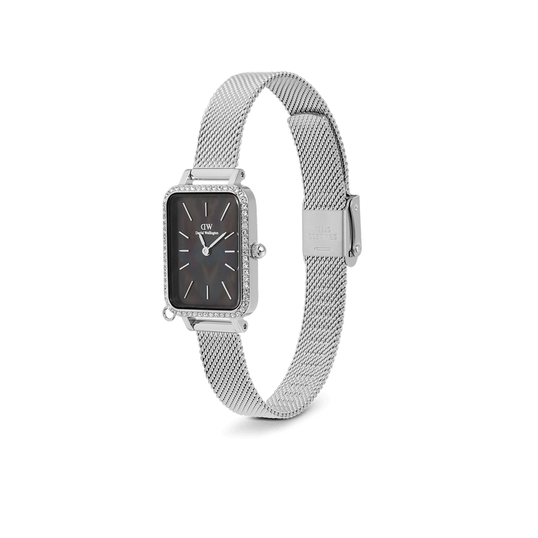 Daniel Wellington Quadro Crystal Zodiac Sterling Set featuring a rectangular silver case with crystal detailing, a black mother of pearl dial, and an adjustable silver mesh strap.