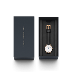 Petite Roman Numerals Sheffield Rose Gold ladies watch presented in a sleek branded gift box, featuring a rose gold case, white dial with Roman numerals, blue steel hands, and a black leather strap.