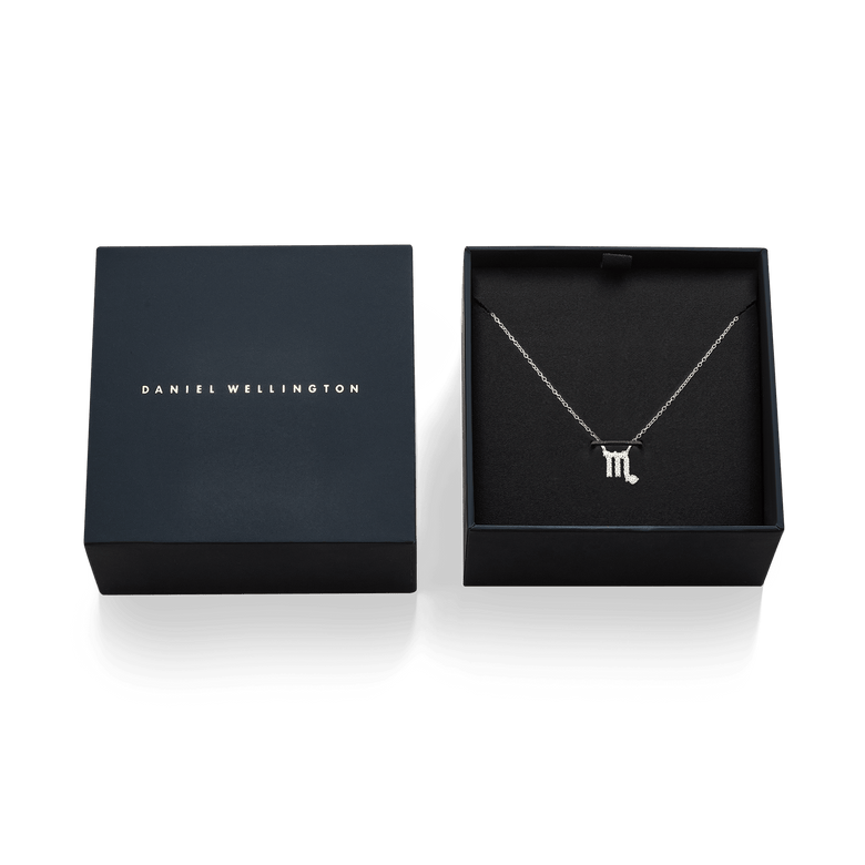 Crystal Zodiac Chain Necklace Silver displayed in an open designer gift box, featuring a delicate silver chain and a Scorpio zodiac pendant adorned with sparkling hand-set crystals.