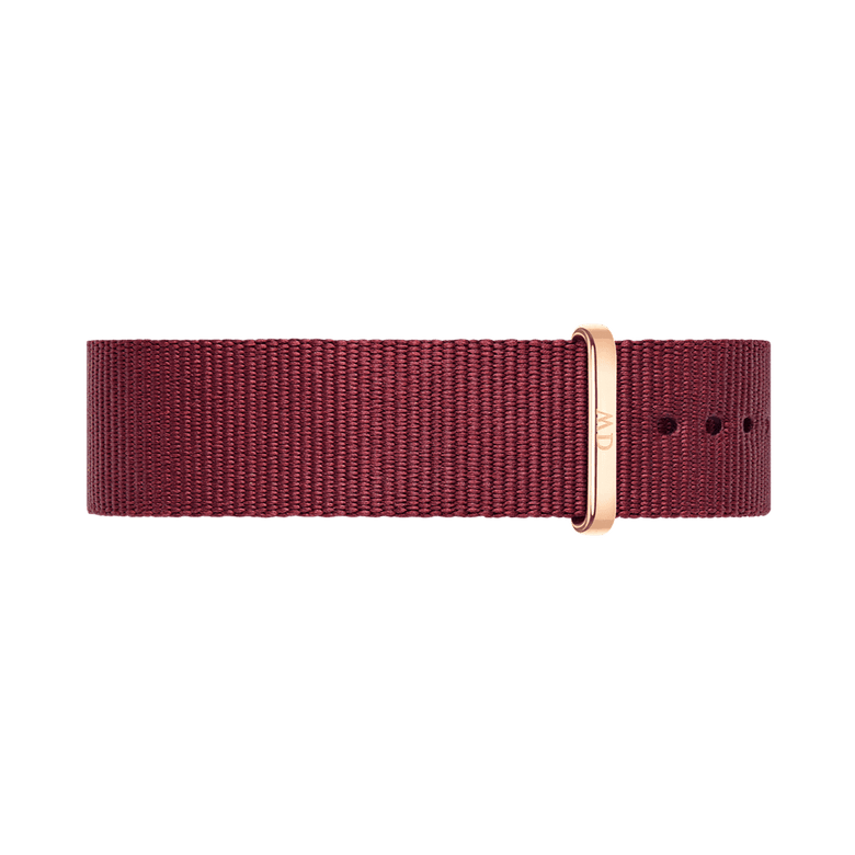 NATO style watch strap in rich ruby red polyester with a rose gold buckle, featuring a slim, minimalist design and adjustable fit.