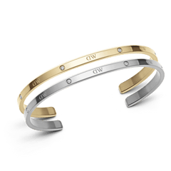 Classic Lumine Bracelet Silver + Gold set featuring two slim stainless steel cuff bracelets, one in polished gold and one in silver, each adorned with sparkling crystals along the band and designed for comfortable everyday wear.