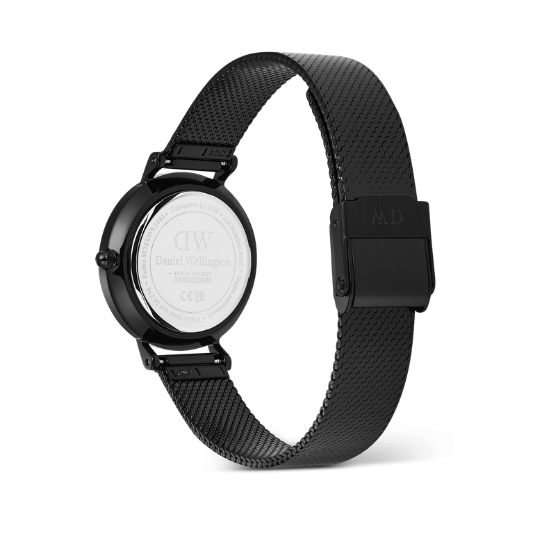 Daniel Wellington Petite Reflection Black watch showing the engraved stainless steel case back and adjustable black mesh strap with a secure clasp.