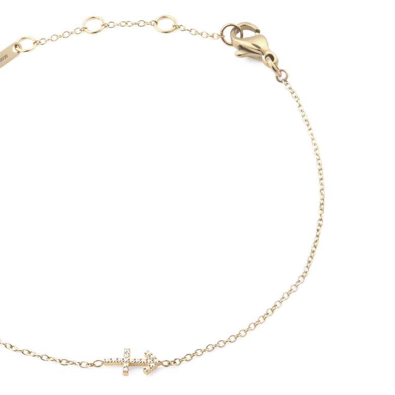 Crystal Zodiac Chain Bracelet Gold featuring a slim gold chain, adjustable sizing rings, and a sparkling crystal zodiac charm, finished with a secure lobster clasp.