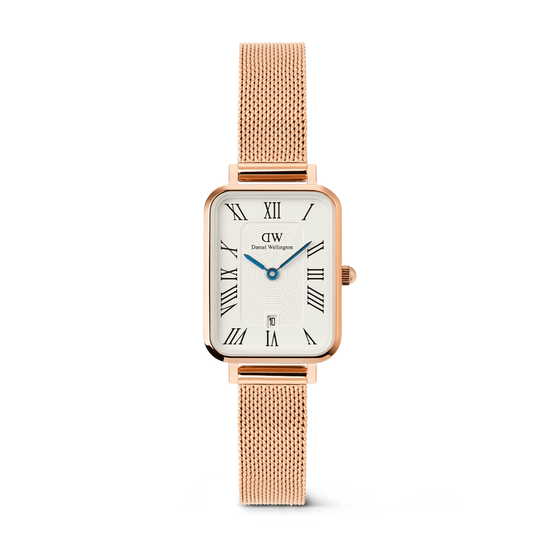 Rose gold ladies watch with a rectangular case, white dial featuring Roman numerals, blue hands, date display at 6 o’clock, and a mesh strap, ideal for everyday elegance and versatility.
