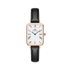 Quadro Roman Numerals Sheffield Rose Gold ladies watch with a rectangular rose gold case, white dial featuring Roman numerals and blue steel hands, paired with a slim black leather strap.
