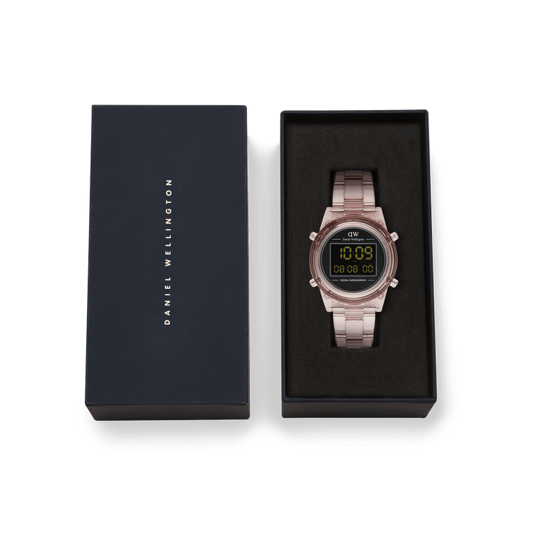 Retro Digital Dark Pink Dark Pink women’s watch with a transparent pink strap and black digital dial, presented in a Daniel Wellington gift box with minimalist black and gold branding.