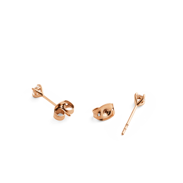 Close-up of Mirelle Solitaire Stud Earring Rose Gold, showing the butterfly backs and slim rose gold posts, highlighting the secure and comfortable design for sensitive ears.