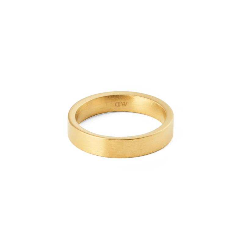 Line Ring Brushed Gold 4.5mm displays a sleek, matte gold band with minimalist lines and a subtle interior logo, ideal for both men and women seeking a refined everyday accessory.