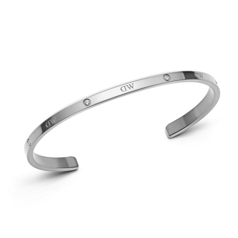 Classic Lumine Bracelet S shown as a slim, open silver cuff with six sparkling crystals and a polished finish, designed for comfortable stacking and everyday elegance.