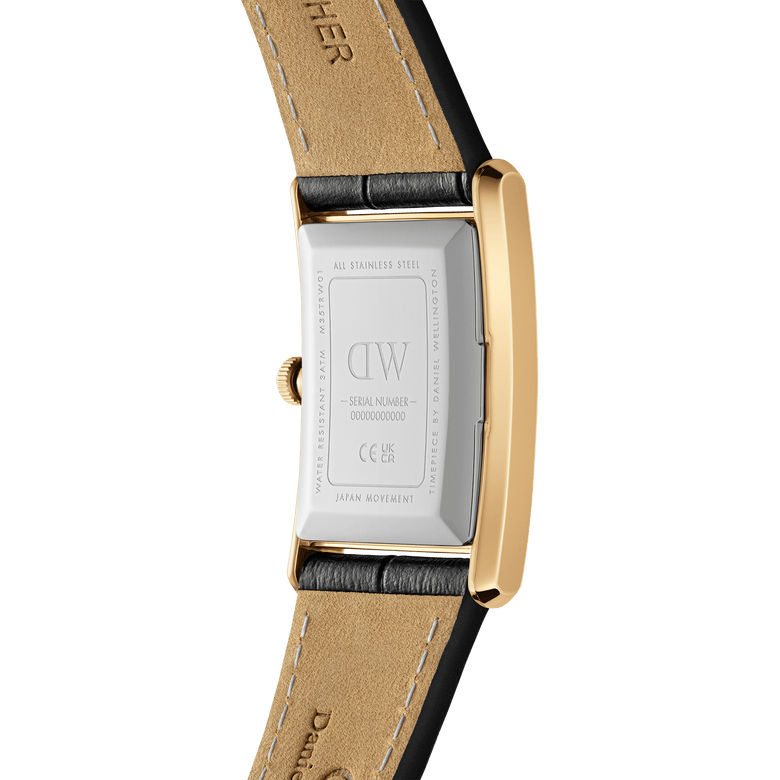Close-up of the back of the Daniel Wellington Bound Black Crocodile Gold watch, highlighting the stainless steel case, gold edges, and premium black crocodile-embossed leather strap with beige lining.