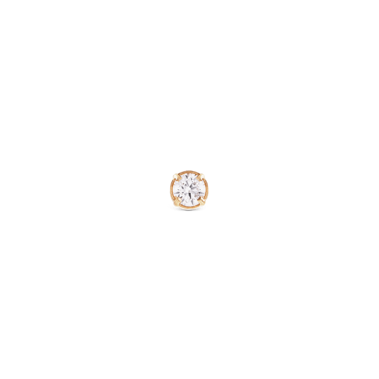Crystal Stud Gold features a petite round cubic zirconia set in a gold-plated claw setting, offering a minimalist and elegant look suitable for everyday wear or layering with other earrings.
