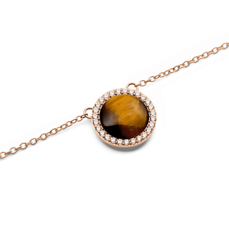 Close-up of the Audrey Necklace Tiger Eye Rose Gold pendant, featuring a domed tiger eye stone surrounded by a halo of white cubic zirconia crystals on a fine rose gold chain.