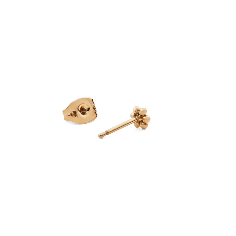 Flower Stud Gold earring with a petite floral motif and warm gold finish, shown with its butterfly backing for secure and comfortable wear.