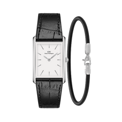 Rectangular silver Daniel Wellington watch with a white dial and black crocodile-embossed leather strap, paired with a slim Sheffield Bracelet in silver and black, both displayed against a plain background.