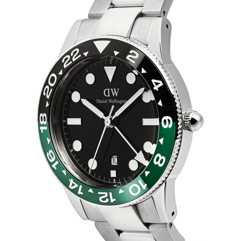 Close-up of the Daniel Wellington Iconic GMT Link Black Green Ceramic Bezel Silver watch, highlighting the black dial, green and black ceramic bezel, and polished silver stainless steel bracelet with a visible date window and GMT hand.