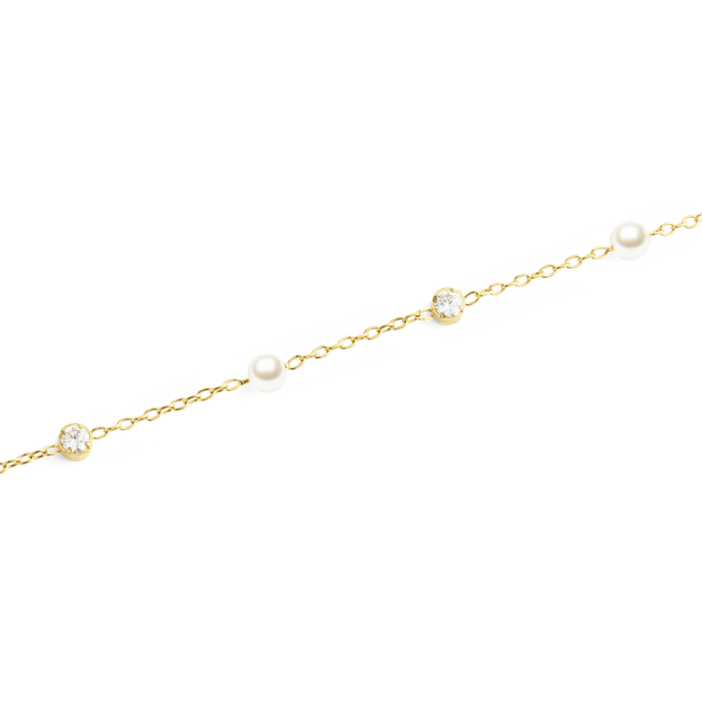 Close-up of the Pearl Bracelet Gold, showing alternating white Swarovski glass pearls and sparkling cubic zirconia stones set along a delicate gold chain.