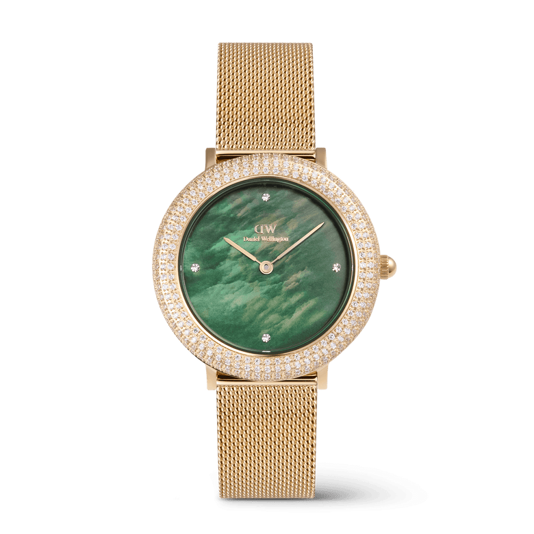 Gold ladies watch with a green mother of pearl dial, crystal-set bezel, and a gold mesh strap, featuring four crystal markers and a 32mm case.