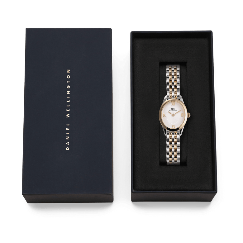 Ophelia Mini Two Tone Gold ladies watch with a gold and silver link bracelet and oval case, presented in a black Daniel Wellington gift box.
