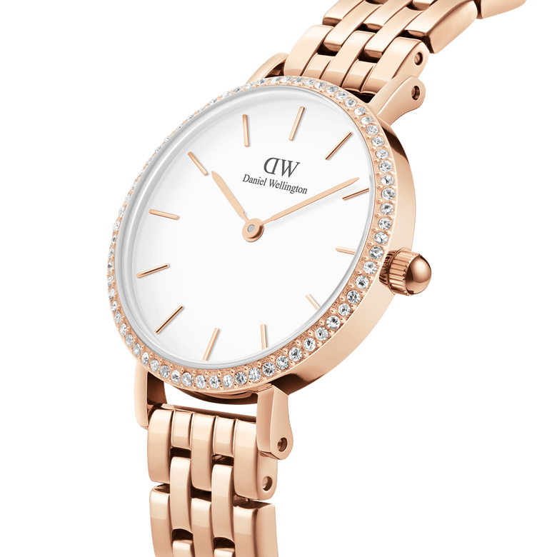 Close-up of the Petite Lumine Bezel 5-Link Melrose watch showing its rose gold 5-link bracelet, crisp white dial, and sparkling gemstone bezel, highlighting its elegant and refined design for women.