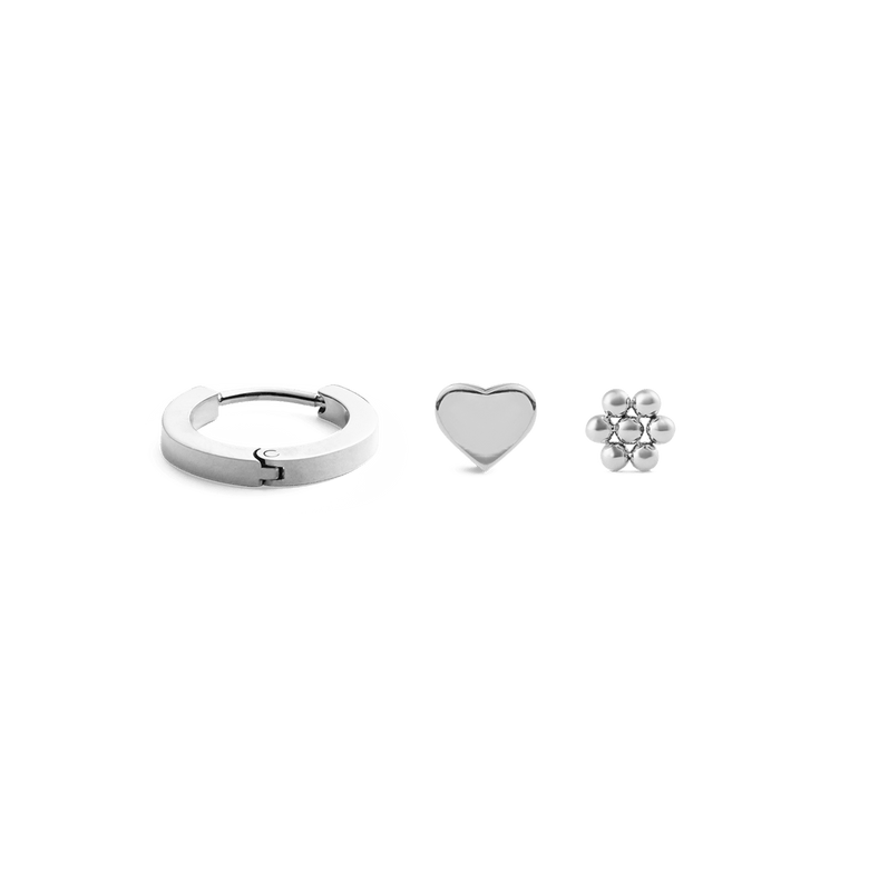 Silver earring set featuring a small hoop, a heart-shaped stud, and a flower stud, each with a polished finish and minimalist design, ideal for mix-and-match styling.