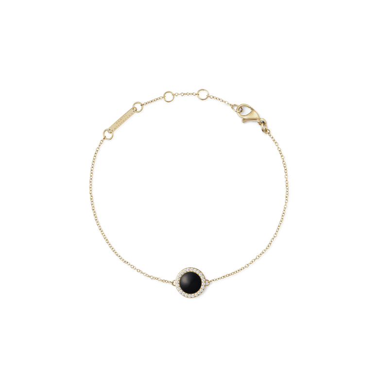 Delicate gold bracelet featuring a slim adjustable chain, a round black agate stone pendant framed by sparkling white crystals, and a secure lobster clasp.