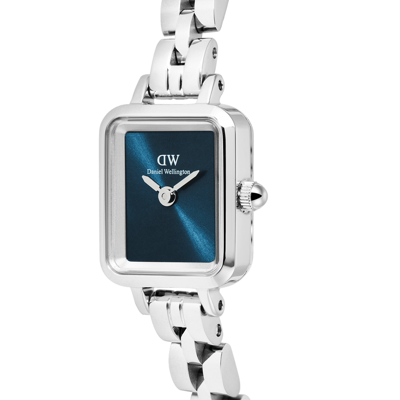 Close-up of the Quadro Mini Arch 3-link Arctic Sunray Silver watch, highlighting its rectangular stainless steel case, polished silver bracelet, and deep blue minimalist dial.