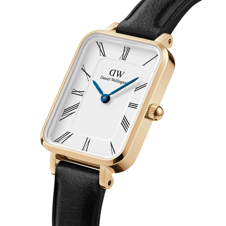 Quadro Roman Numerals Sheffield Gold ladies watch featuring a rectangular gold-plated case, minimalist white dial with Roman numerals, blue steel hands, and a slim black leather strap.