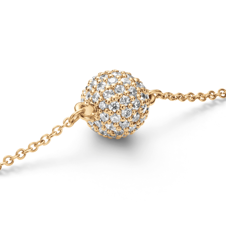 Close-up of the Pavé Crystal Pendant Bracelet Gold showing the sphere-shaped pendant set with claw-set cubic zirconia crystals on a fine gold chain.