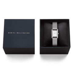 Bound Mini Sterling ladies watch with a rectangular silver-tone case and mesh strap, presented in a dark branded Daniel Wellington gift box.