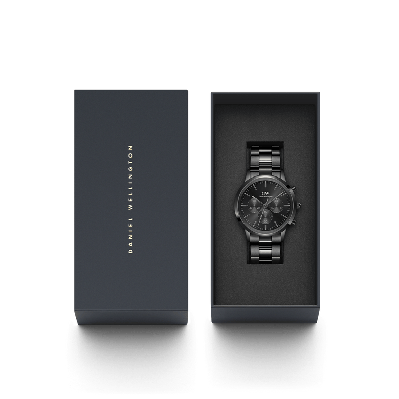 Iconic Chronograph Link Onyx B men's watch presented in a Daniel Wellington gift box, featuring an all-black stainless steel bracelet and minimalist chronograph dial.